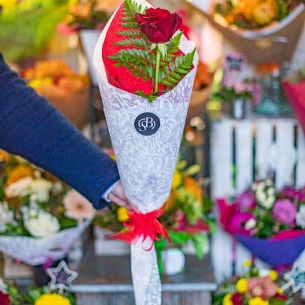 Fresh red rose bouquet with greenery, perfect for flower delivery - Simply Blooming NZ.