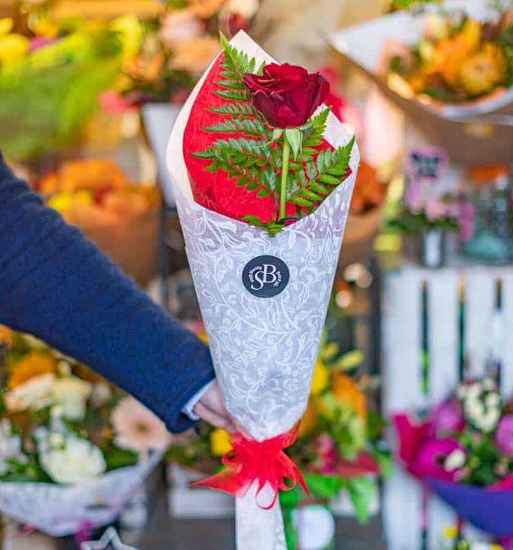 Fresh red rose bouquet with greenery, perfect for flower delivery - Simply Blooming NZ.