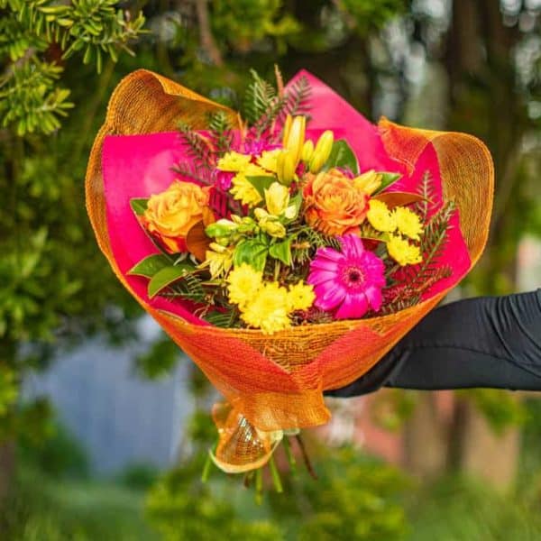 Vibrant floral bouquet with colourful roses, lilies, and gerberas for special occasions.