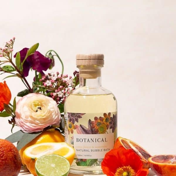 citrus flower and water mint bubble bath Botanical natural bubble bath surrounded by fresh citrus fruits and flowers, organic skincare product from Simply Blooming New Zealand.