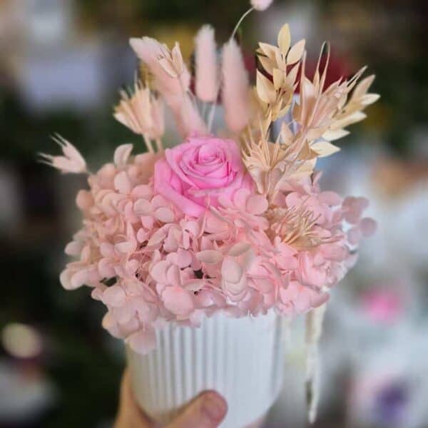 Elegant pink flower arrangement with roses and hydrangeas, perfect for special occasions or home decor.