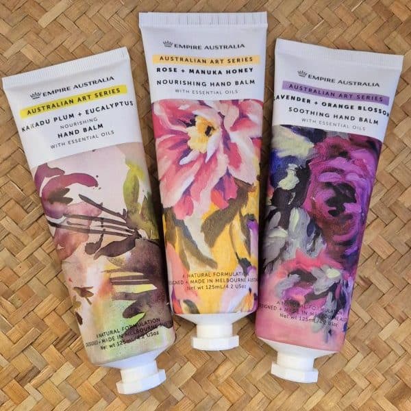 Botanical hand balm tubes with Australian art designs, floral packaging, and essential oils.