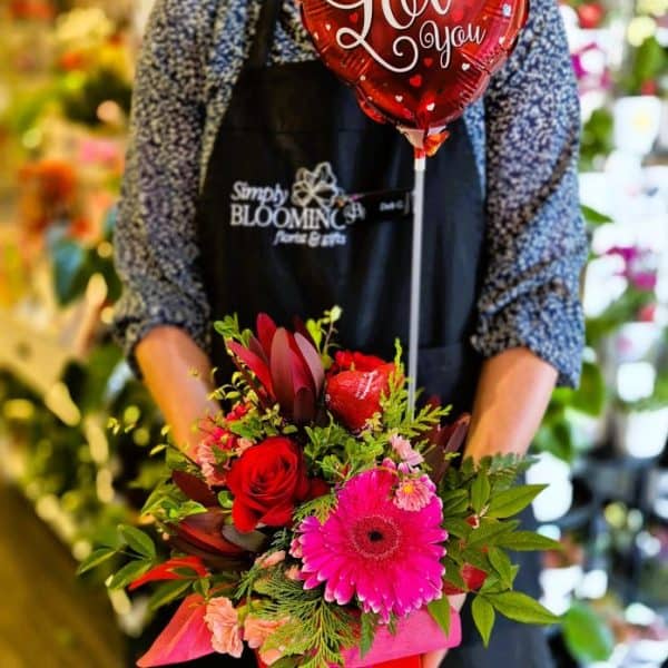 Sweet Valentine's Day flower arrangement from Simply Blooming, featuring vibrant roses, gerbera, and lush greenery.