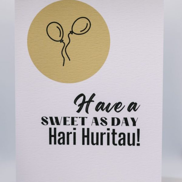 Bright birthday card with balloons and a festive message for Hari Huritau celebration.