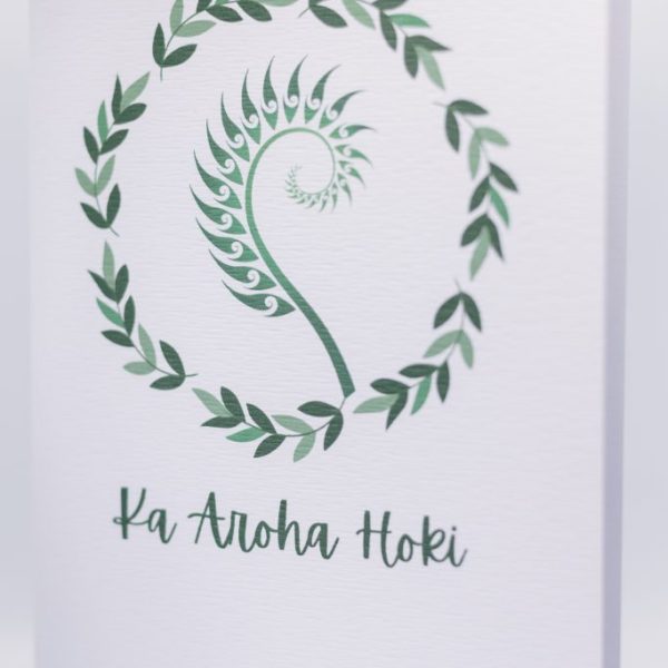 Vibrant tropical-inspired wedding invitation featuring a fern spiral design and 'Ka Aloha Hoki' message.