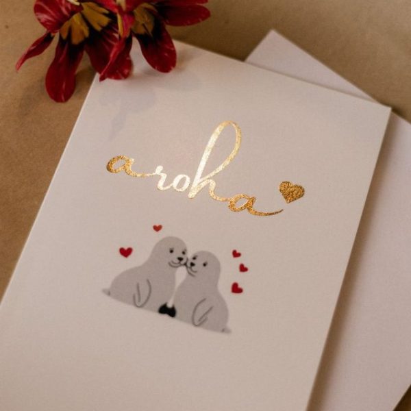 Aroha greeting card featuring adorable seals and love hearts, ideal for expressing affection and friendship.
