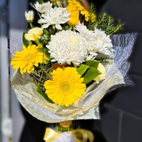 1. yellow large vase of flowers 3 Yellow and white floral bouquet in Simply Blooming style with gerbera daisies, chrysanthemums, and lisianthus.