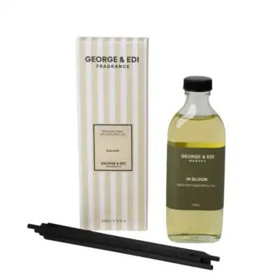 Fresh reed diffuser refill oil with black diffuser reeds for home fragrance. Perfect for enhancing your living space.