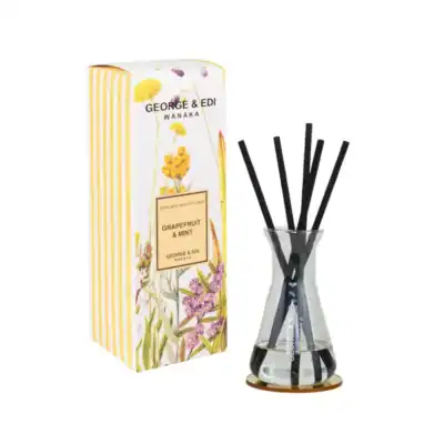Grapefruit & Mint reed diffuser set with black reeds and floral packaging for home fragrance enhancement.
