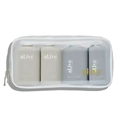 Moisturising body care products in a clear travel bag, minimalist, white and grey tones.