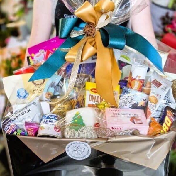Deluxe New Zealand gourmet gift basket with chocolates and snacks.