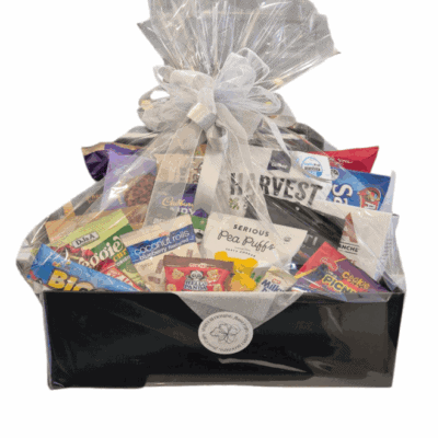 Indulgent sweet gift hamper with assorted chocolates and treats in a black gift box.