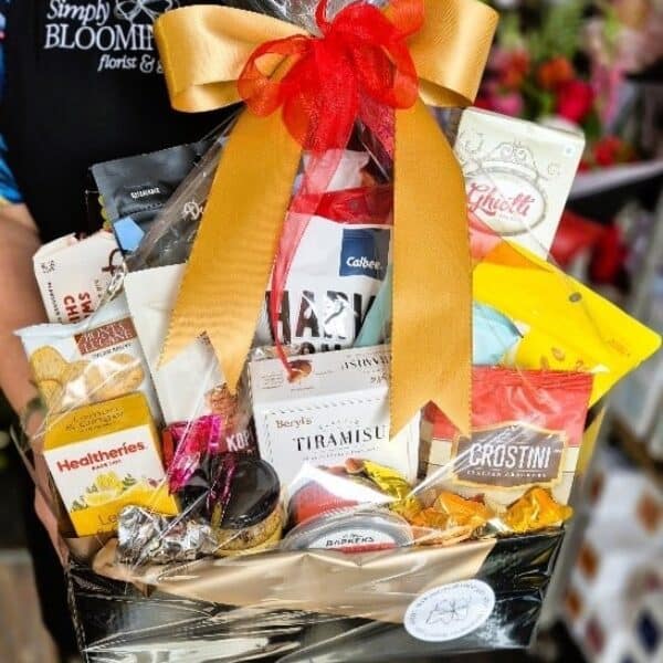 Elegant gift basket featuring chocolates, biscuits, and gourmet treats, ideal for celebrations and gifting from Simply Blooming NZ.