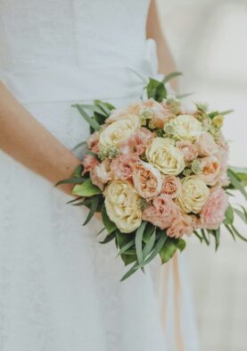 pastel and white bridal bouquet Soft pastel wedding bouquet featuring roses and lisianthus for a romantic wedding floral arrangement.