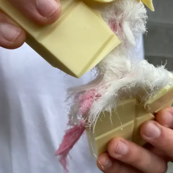 Handcrafted soap with wool and pink details, perfect for natural skincare.