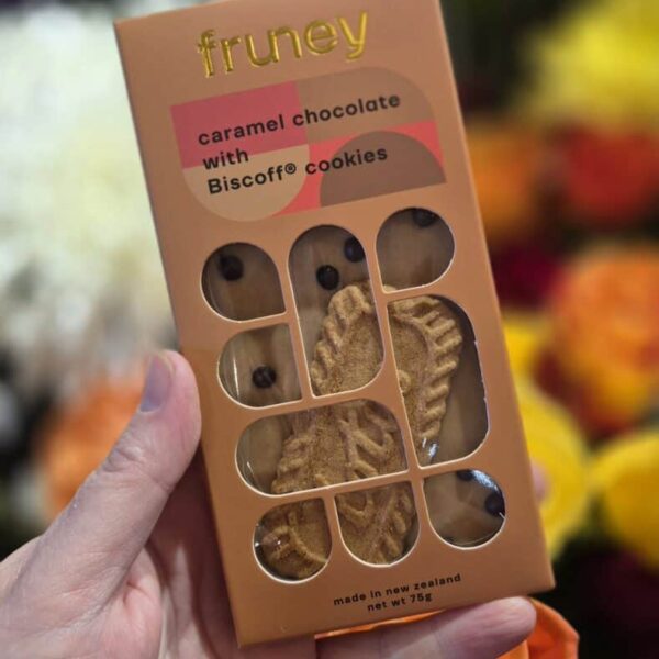 Delicious caramel chocolate cookies with biscuit and cookie ingredients, packaged in a pink box with.