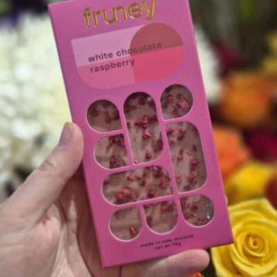 Delicious white chocolate raspberry bar with fresh raspberries, perfect for gifting or indulgence.