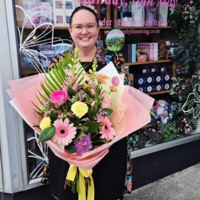 Mother's Day floral bouquet with vibrant pink, yellow, and purple flowers.