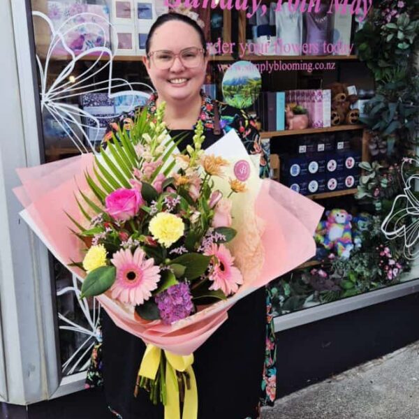 Mother's Day floral bouquet with vibrant pink, yellow, and purple flowers.