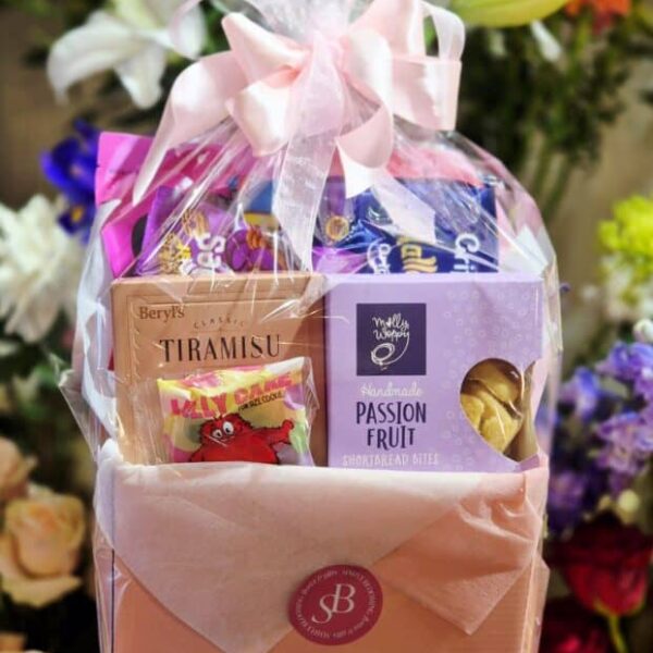 Delightful sweet treat gift basket with chocolates and candies. Perfect for special occasions and gi.