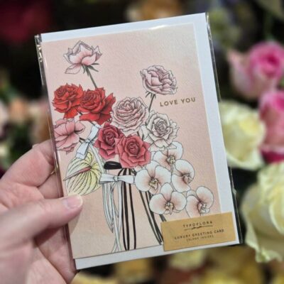 Beautiful floral greeting card with pink and red roses and orchids.