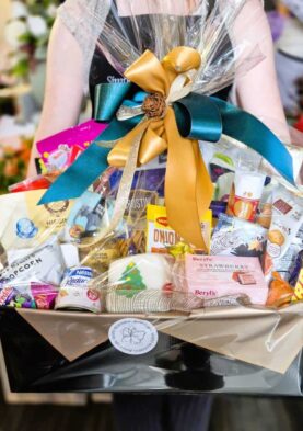 Beautiful Gift Basket from Simply Blooming Elegant gift basket with flowers, chocolates, and treats from Simply Blooming.