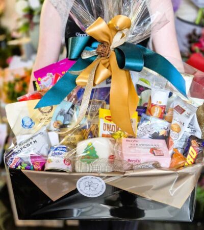 Beautiful Gift Basket from Simply Blooming Elegant gift basket with flowers, chocolates, and treats from Simply Blooming.